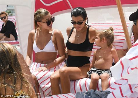 hailey baldwin flaunts tan in sizzling white swimsuit daily mail online