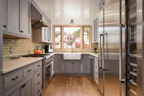 This galley kitchen combines dark wood cabinets, glass tile backsplash, and. 23 Small Galley Kitchens (Design Ideas) - Designing Idea