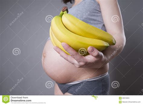 Woman With Bananas In Hands In Hat Exotic Fruits Lifestyle Pink Background Royalty Free Stock