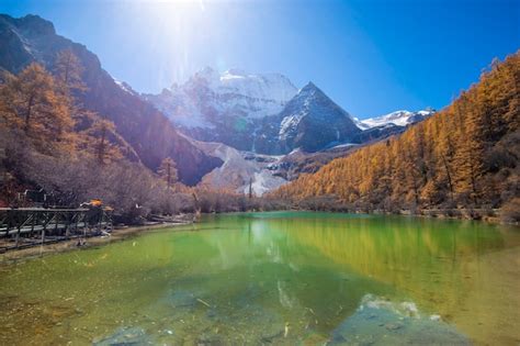 Premium Photo Pearl Lake With Snow Mountain In Yading Nature Reserve