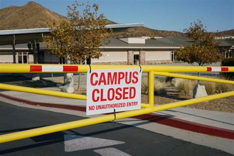 Close Up Of School Campus Closed Sign On Gate Stock Photo Image Of