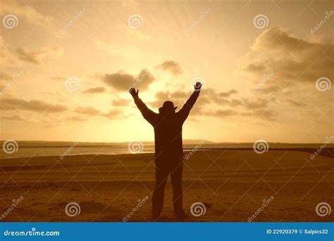 A Silhouette Of A Man With His Arms In The Air Stock Image Image Of