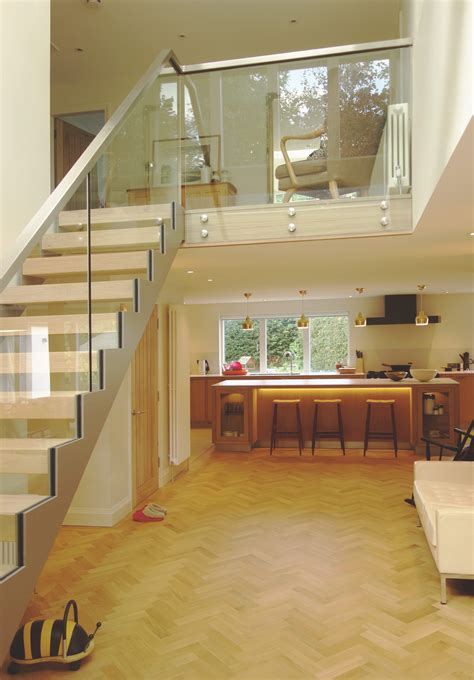 Galleried Landing Steel And Glass Open Tread Stair With Herringbone