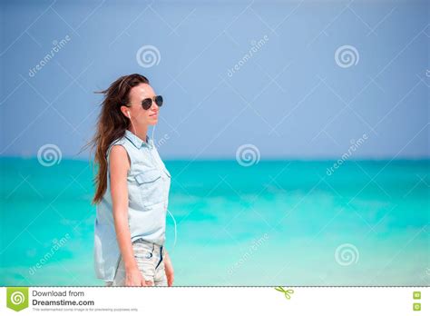Young Beautiful Woman During Tropical Beach Vacation Stock Photo
