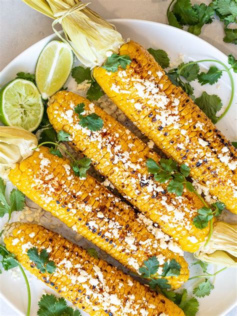 This grilled corn recipe is coated with a cooling lime crema, spiced with some chile powder, and topped with crumbled add your choice of toppings. Healthy Grilled Mexican Street Corn (Elotes) with Chili Lime Oil and Cotija Cheese | Recipe ...