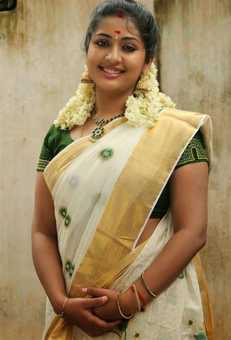 Malayalam Actress Navya Nair Smiling Stills In White Saree Actress Album