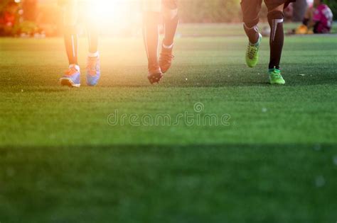 Soccer Player In Action On Sunset Stadium Panorama Background Stock