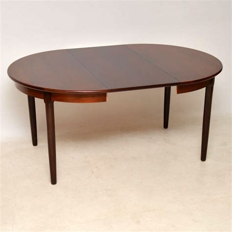Round extending table with aluminium runners. 1960's Vintage Danish Rosewood Extending Dining Table ...