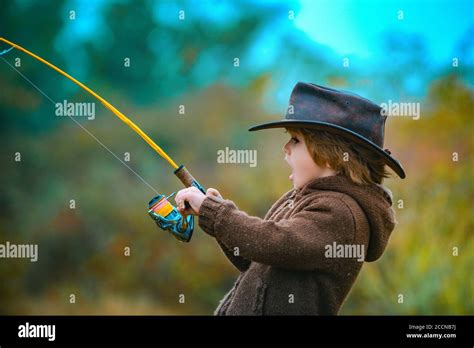 Kid Fishing With Spinning Reel Kids Fly Fishing Stock Photo Alamy