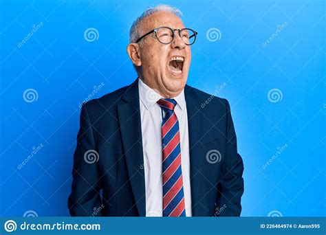 Senior Caucasian Man Wearing Business Suit And Tie Angry And Mad