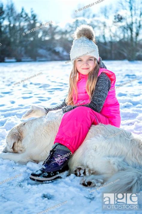 Little Girl Sitting On A Dog Stock Photo Picture And Royalty Free