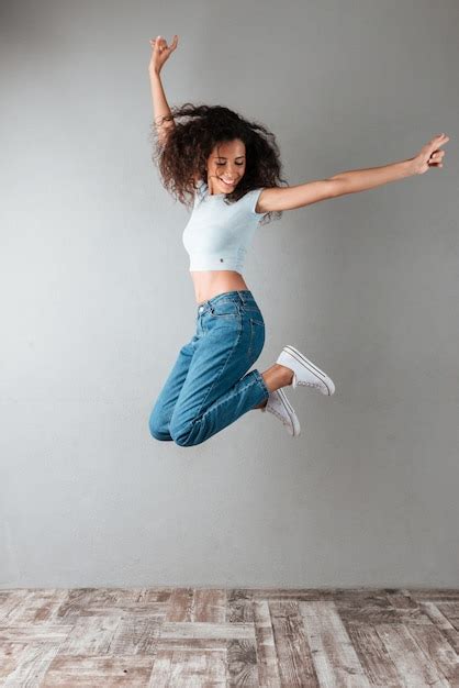 Joyful Woman Jumping Free Photo