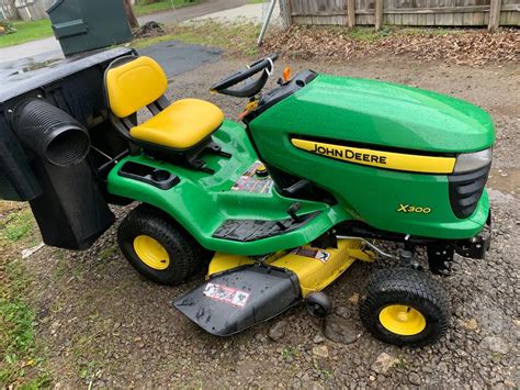 42in John Deere X300 Lawn Tractor Wbagger And Front Blade 285 Hours