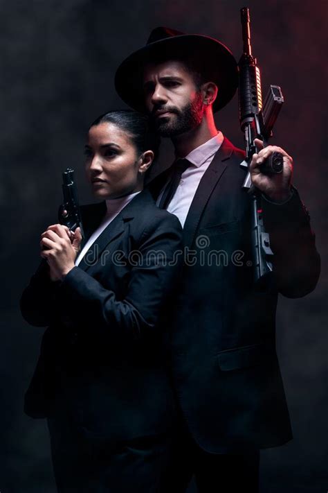 Gangster Couple Fashion Or Gun On Studio Background In Secret Spy