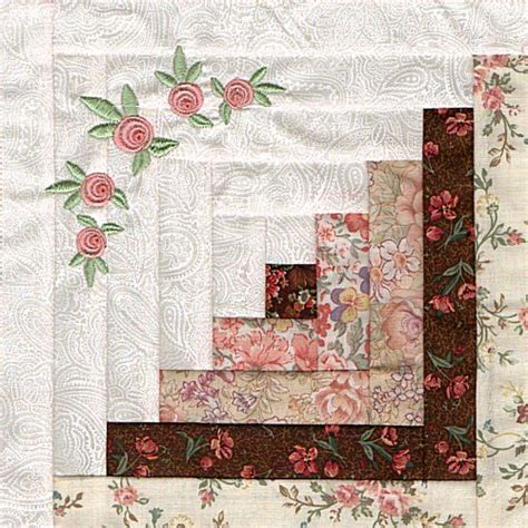 A Quilted Wall Hanging With Flowers On It
