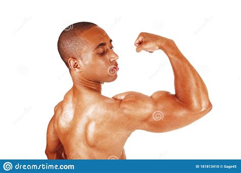 Young Man Flexing His Biceps In Close Up Stock Photo Image Of Person