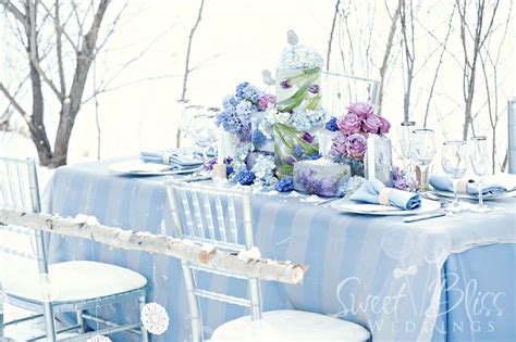 Winter Wedding Tablescape With Flowers Frozen In Ice
