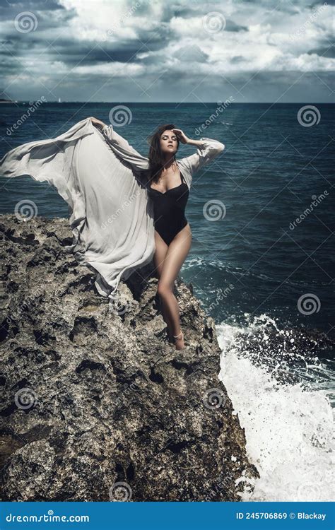 Stunning Is Standing Woman On On The Edge Of A Cliff Stock Image Image Of Flying Light 245706869