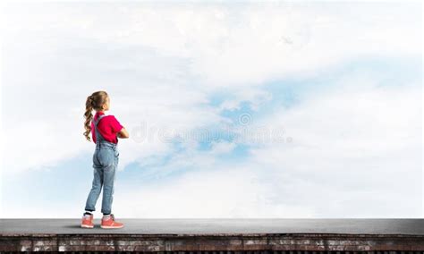 Concept Of Careless Happy Childhood With Girl Looking Far Away Stock