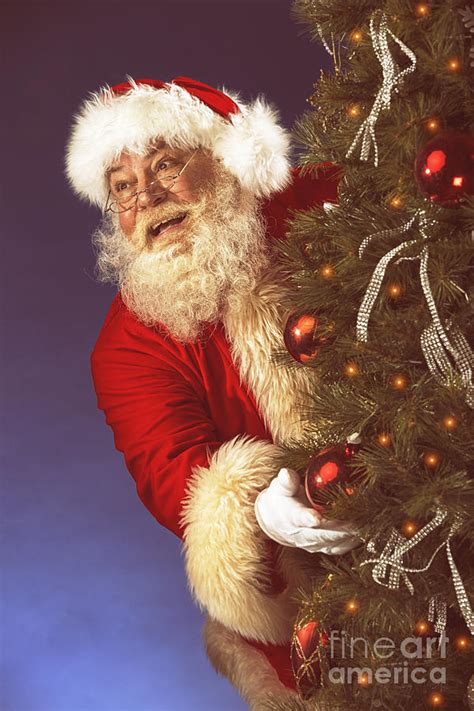 Vintage Santa Claus Hiding Behind Christmas Tre Photograph By Dieter Spears