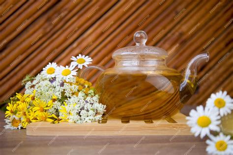Premium Photo A Teapot Of Herbal Tea With Chamomile