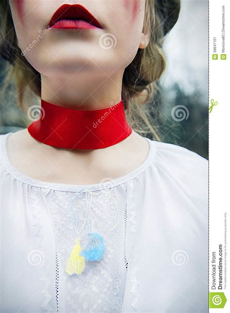 Girl In Tears And With A Red Ribbon Around Her Neck As A Symbol Of