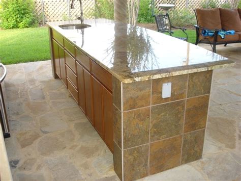 But a 42″ high surface, while a great place to set another traditional countertop surface is tile. Outdoor Kitchen - Tile Back Splash, Bar Tile, Granite ...