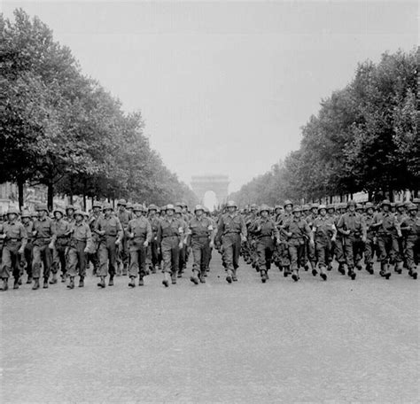 American Troops Of The 28th Infantry Division March Down The Champs