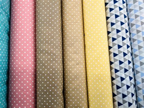 Sample Of Pastel Colored Fabrics With Polka Dot Prints Displayed In The