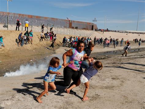 Photographer Reveals Story Behind Iconic Image Of Fleeing Migrants At Mexico Border
