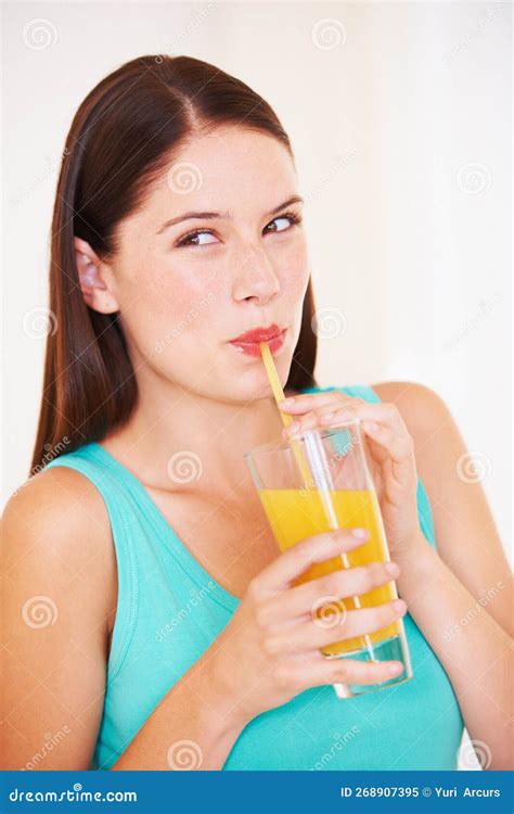 Orange Juice Is The Best A Beautiful Young Woman Drinking Orange Juice