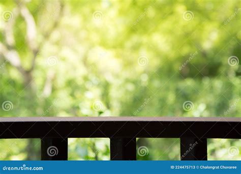 Wooden Slatted Balcony On Natural Blurred Background With Sunlight
