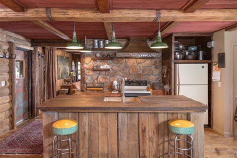 Esta foto es un ejemplo perfecto para ti. Rustic Kitchen with Custom hood & Hardwood floors in ...