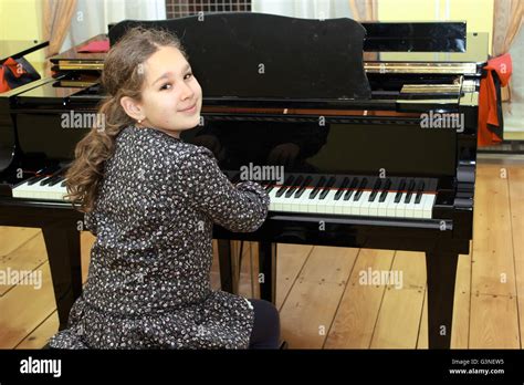 Girl Playing Piano Stock Photo Alamy