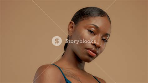Closeup Portrait Of Black Mixed Race Woman With Hair Braid Calm Looking To The Camera Royalty