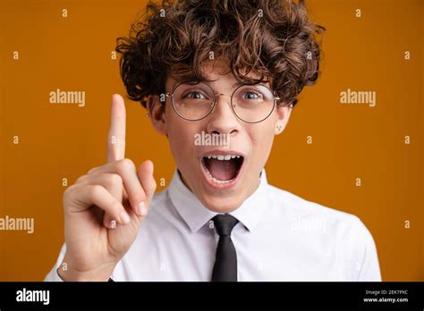 Happy Excited Male Student Standing Wearing Uniform Isolated On A