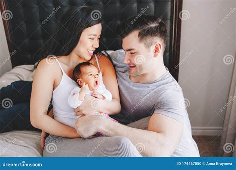 Beautiful Smiling Chinese Asian Mother And Caucasian Father With A