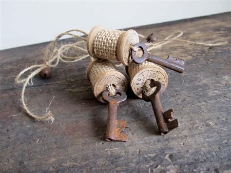 Set Of 3 Rustic Wood Spool Ornaments With Rusty Bells Skeleton Keys