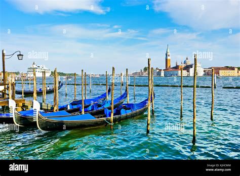 Gondolas Moored By St Marks Square At Dusk In Venice Stock Photo Alamy