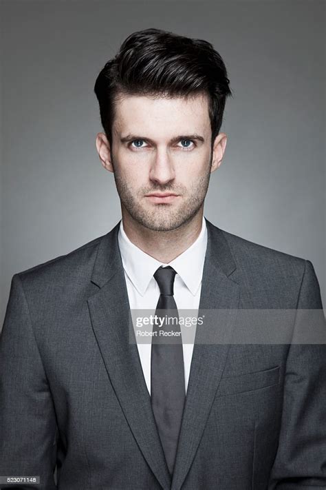 Studio Portrait Of Business Man Wearing Suit High Res Stock Photo