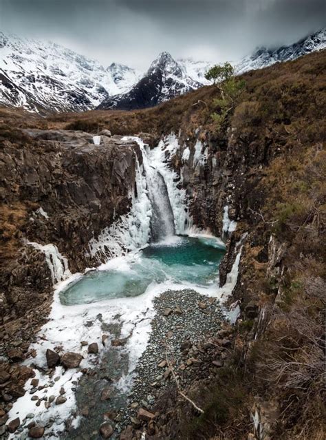 Isle Of Skye With Those Incredible Fairy Pools Beneath The Dusted Black