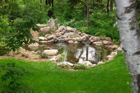 Large Backyard Pond With Natural Stone Water Feature In St Paul Mn