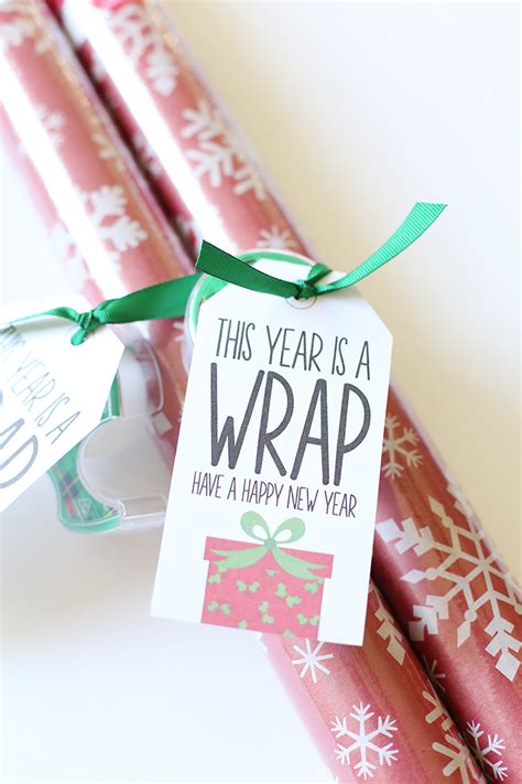 Here, dowels are used to support the weight of. Christmas: Wrapping Paper Gift Idea with Printable Tags ...