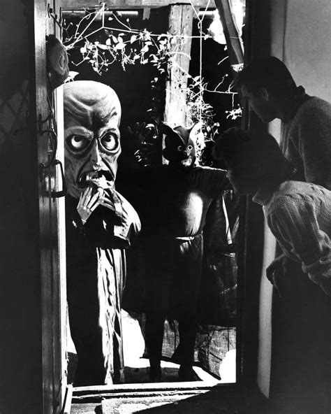 An Old Photo Of A Creepy Man Looking In The Mirror With Another Person