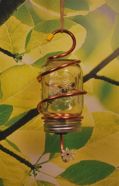 Make your own hummingbird feeder using small mason jars. Mason Jar Hummingbird Feeder | Rustic memories Hand Made ...