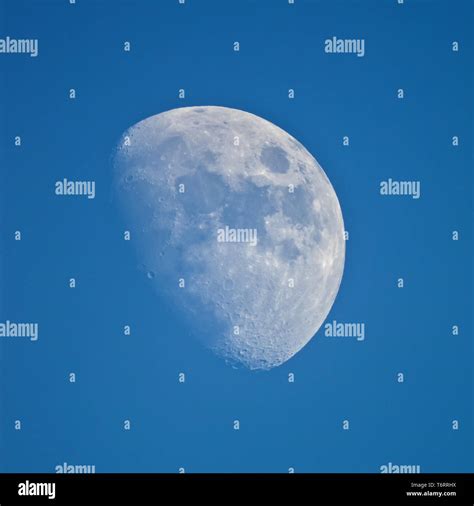 View Of The Moon Through Telescope On The Blue Sky Stock Photo Alamy