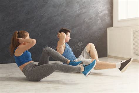 Fitness Couple Lying Doing Crunches Stock Photo Image Of Healthclub