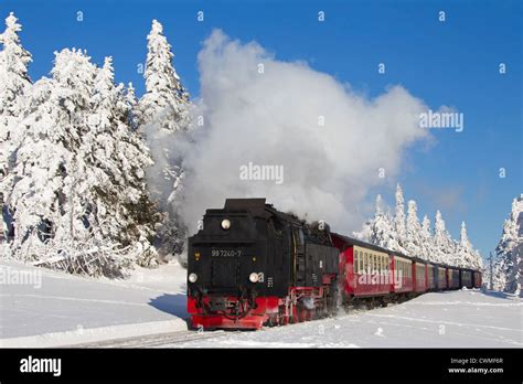 Steam Train Riding The Brocken Narrow Gauge Railway Line In The Snow In