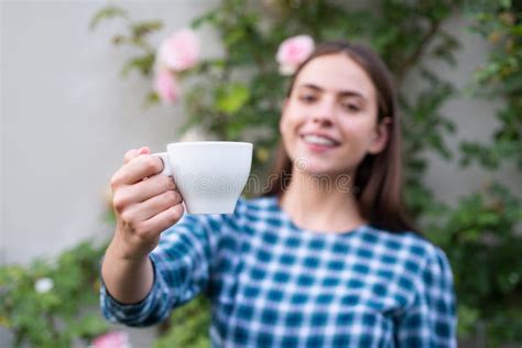 Female Model Holding Cup Of Coffee Female Giving Coffee Stock Photo