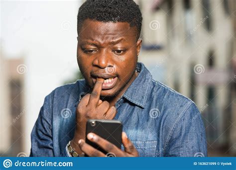 Close Up Of Young African Man With Mobile Phone Stock Image Image Of